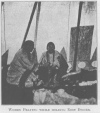 WOMEN PRAYING WHILE HOLDING ROOT DIGGER.