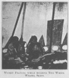 WOMEN PRAYING WHILE HOLDING TWO WHITE-WEASEL SKINS.